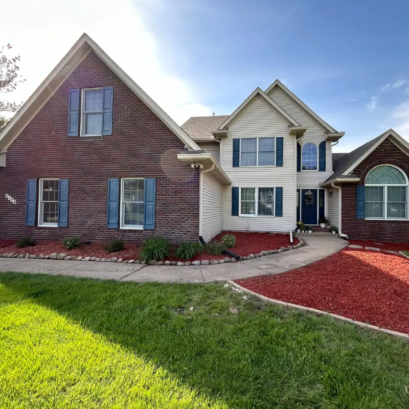 Fresh mulch and landscape planting installation